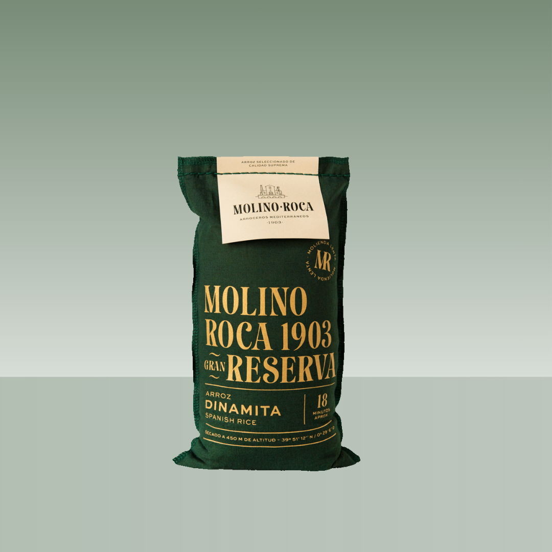 Saco de arroz Molino Roca 1903 Gran Reserva, variedad Dinamita, en envase textil verde con tipografía dorada.