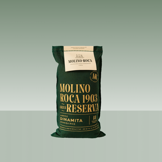Saco de arroz Molino Roca 1903 Gran Reserva, variedad Dinamita, en envase textil verde con tipografía dorada.