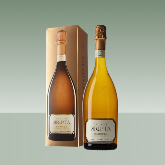 Botella de cava Celler Kripta Barrica Gran Reserva junto a su estuche, vidrio dorado con cápsula dorada y etiqueta frontal clásica.