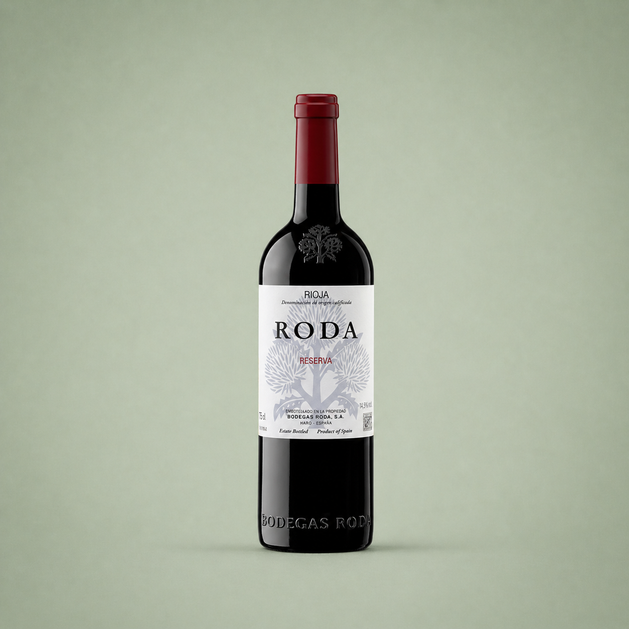 Botella de vino tinto Bodegas Roda Reserva Rioja con etiqueta blanca y cápsula roja.